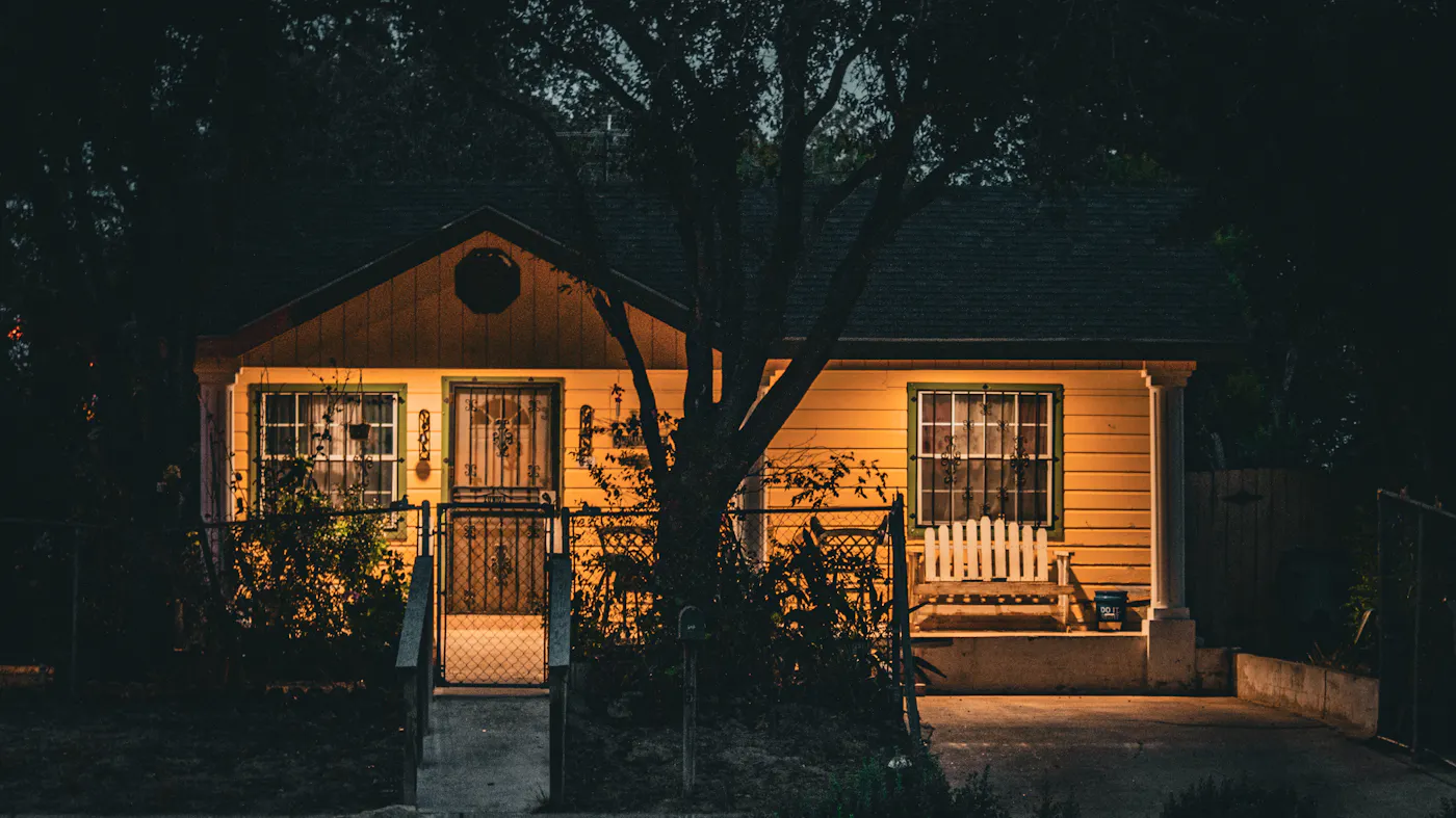 A charming Texas single-family home illuminated at evening — the kind of Austin home a listing would target