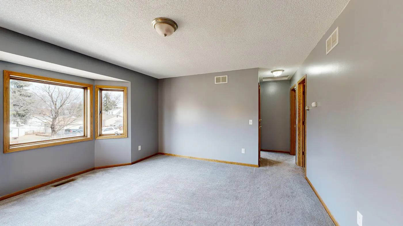 A sunlit empty room inside an inherited Texas home awaiting a probate sale