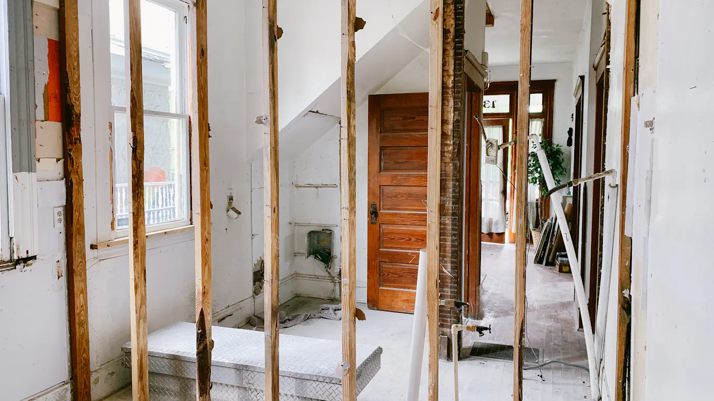 A home mid-renovation after fire damage — the rebuild work a cash buyer takes on instead of the seller