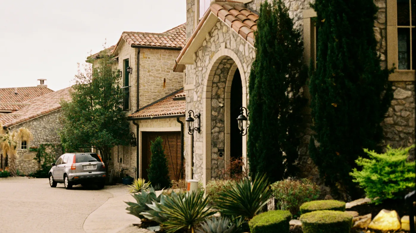 A Texas residence behind a gated entry, the kind of inherited home an heir sells fast for cash