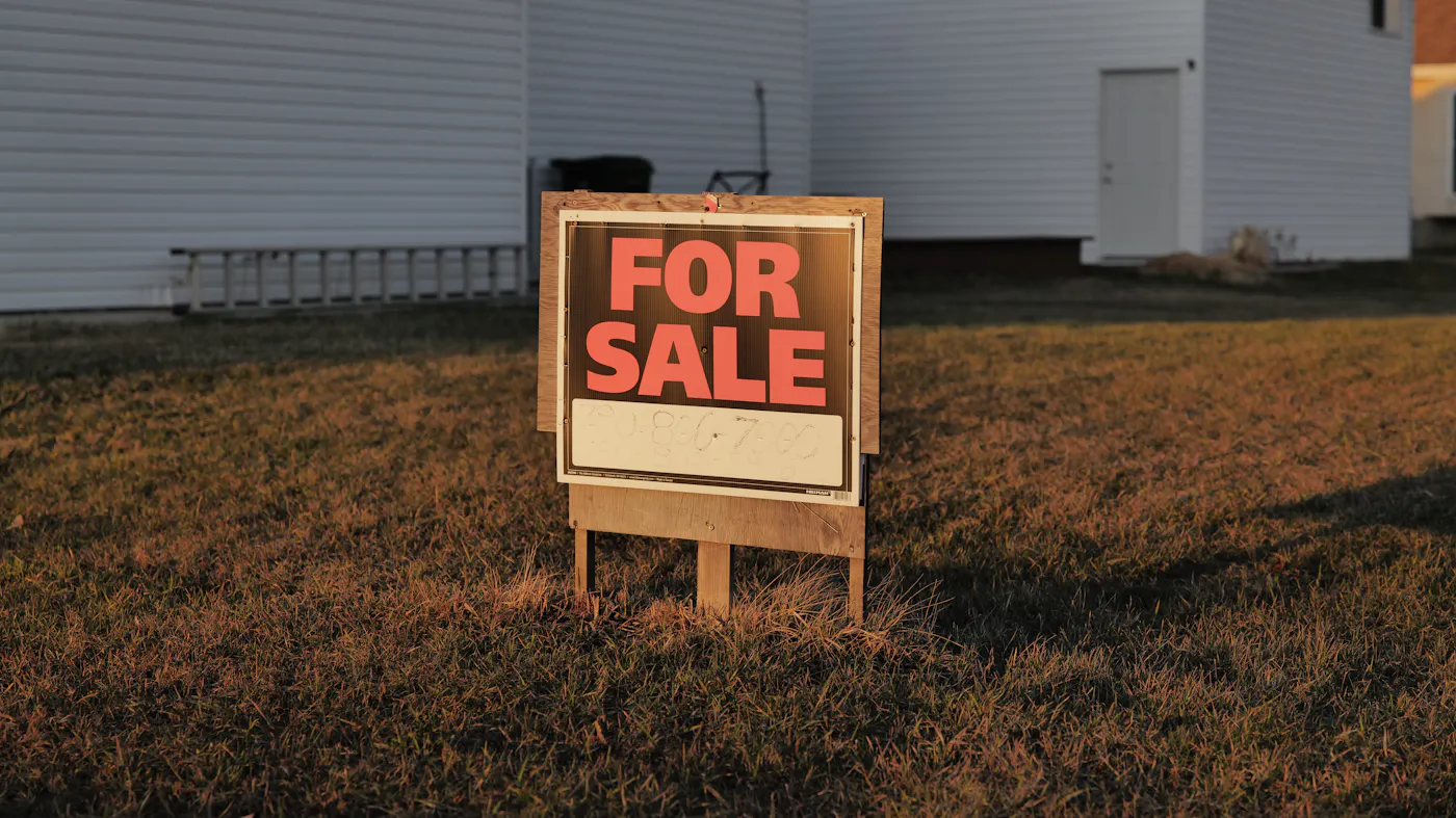 A For Sale sign in a suburban Texas yard, the traditional listing path for selling a home